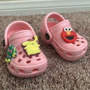 Baby croc style shoes with charms